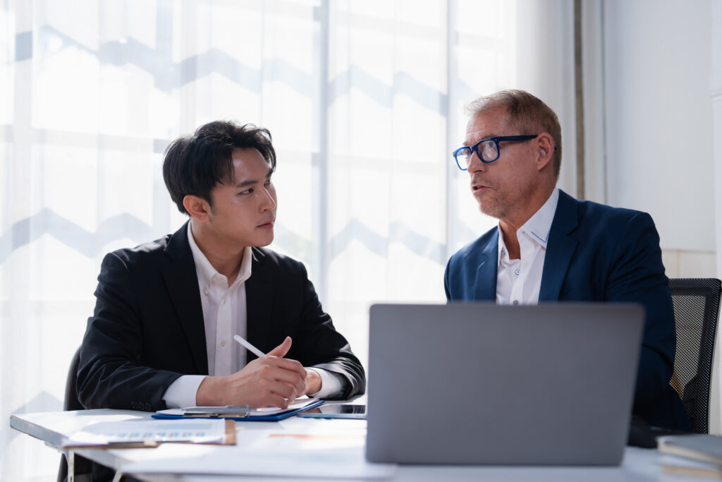 Manager coaching an employee on business presentation skills